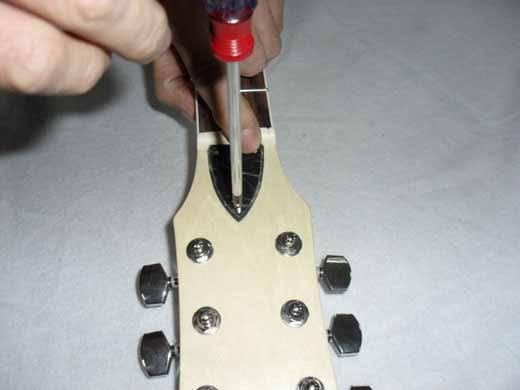 For the last step screw the truss-rod cover. Once the desired action is achieved, all that remains is to set the intonation.