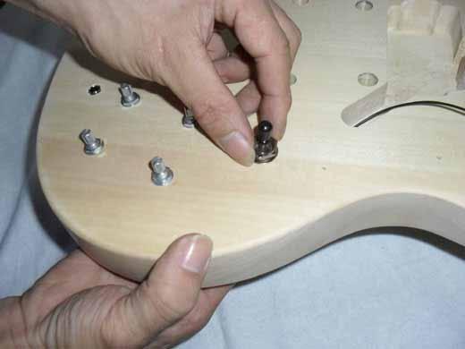 The Tone and Volume potentiometers on the downside should be connected to the neck pickup.