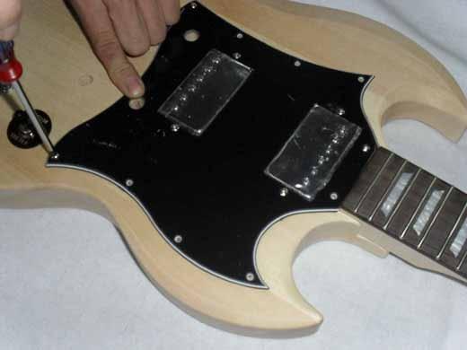 Wiring Secure the pickguard with dome-head screws into the
