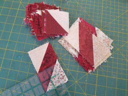 TON of 2 half square triangles.all scrappy so these will be a part of that project.