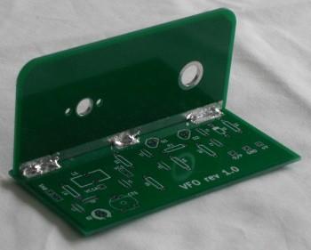 Place the tabs in the slots and with the two halves of the board held at 90 degrees to each other solder them together along the three pads.