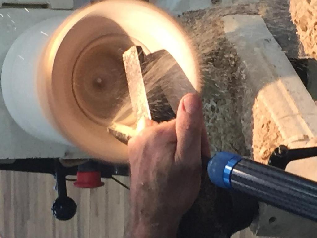 Completing the inside shape of the hollow form with a bowl gouge. Rudy has two favorites, a 60 degree bevel bowl gouge and a 40 degree bevel bowl gouge.
