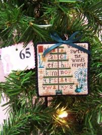 total of the 12 individual items, i.e., 11 ornaments + the tree/santa bag.