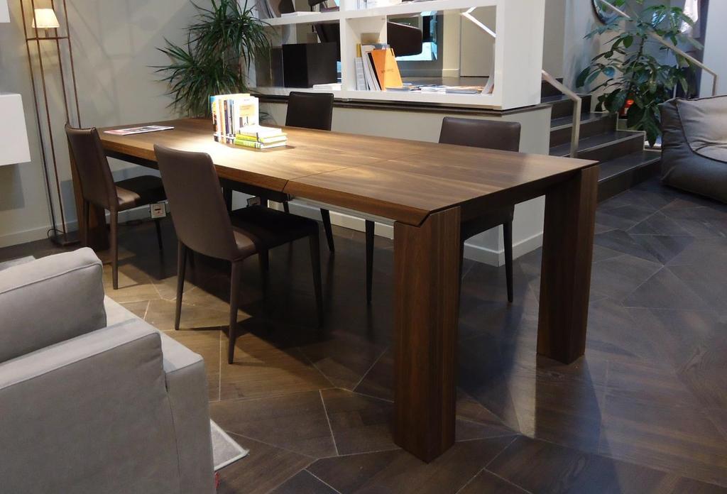 Mod. AMBROGIO Partner: OLIVIERI Extendable table with top and extensions made in honeycomb ply 50 mm thick with 45 finishing. 2 extensions housed inside.