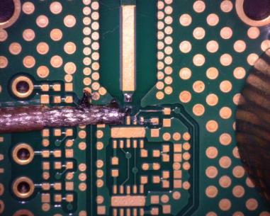 A second approach is to install a connectorized test cable typically semi-rigid coax with the signal pin soldered to the test point and shield of the test cable soldered to ground on the PCB.