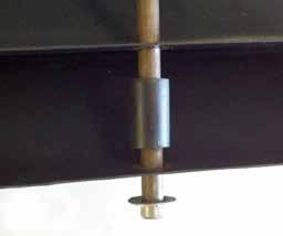 With assistance, stand rods upright with cap nuts at the bottom.