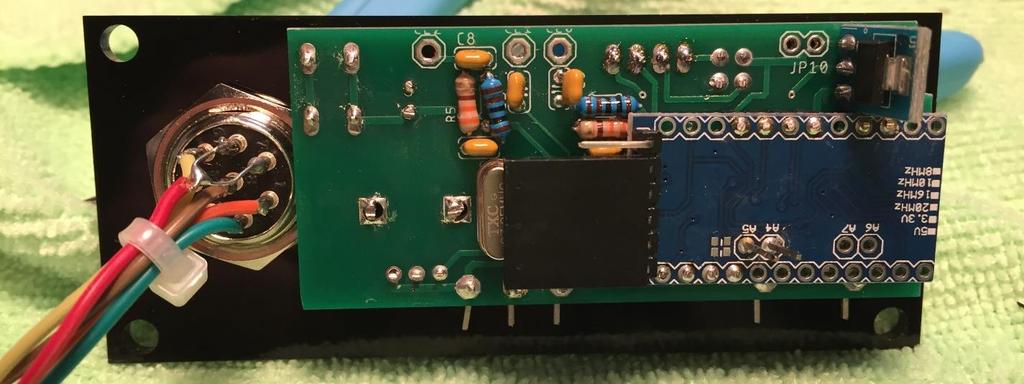 The component side of the Arduino faces this completed PCB and slides onto the back of this PCB as shown in