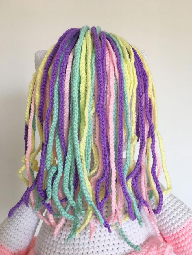 Hair Use baby pink, light mint, light yellow and lilac yarn and work in rows. (Make 12 of each color) Make 70 chains.