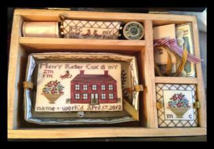 workbox. Inside the painted workbox is a stitched tray with a poem Merry wrote.