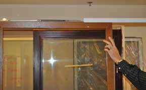 Secure the screen hanger using the hanger screws pre-installed in the top rail of the