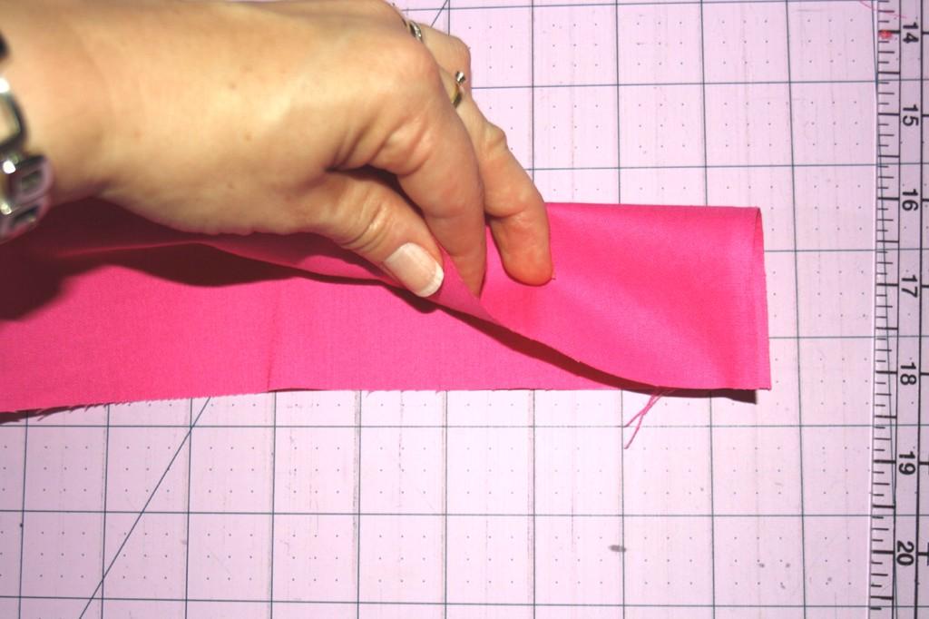 5 Take your long fabric strip and fold it