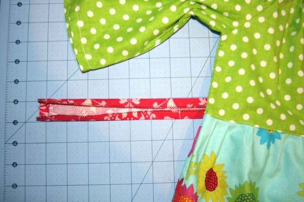 5 Position your folded fabric strip with wrong side up, then place your garment