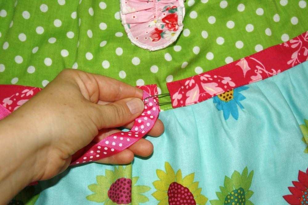 8 Secure a safety pin to end of ribbon and insert it