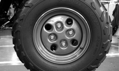 The ATV is equipped with low-pressure tubeless tires of the size and type listed below. Do not under any circumstances substitute tires of a different type or size. Do not mix tire tread patterns.