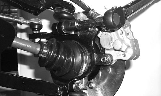 On the left side, secure the swing arms to the axle housing and frame brackets with cap screws and hex nuts; then tighten all fasteners to specifications. Front A-Arms REMOVING 1.