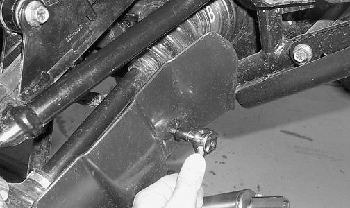 Section Rear A-Arms (FIS - Rear Suspension) REMOVING 1. Secure the ATV on a support stand to elevate the wheels. 2. Pump up the hand brake; then engage the brake lever lock. 3. Remove the wheel.