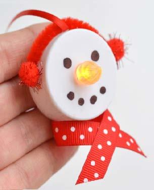 Tea Light Snowman Ornaments Battery operated tea lights 1 Black and 1 Orange Sharpie Red Ribbon (like this and this) Red Pipe Cleaners Red Pom Poms Glue Gun 1.