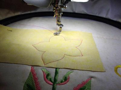 Once embroidered, they are trimmed to size.