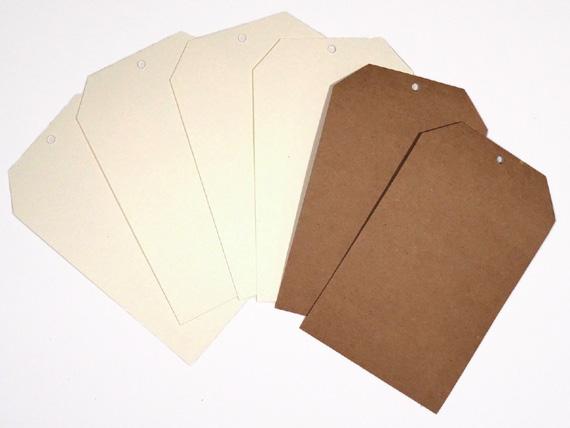 Create four vellum pouches from four vellum pages as follows: Fold just below the lower