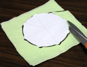 Remove the paper and set it aside. Now prepare the fabric for the back of the trivet.