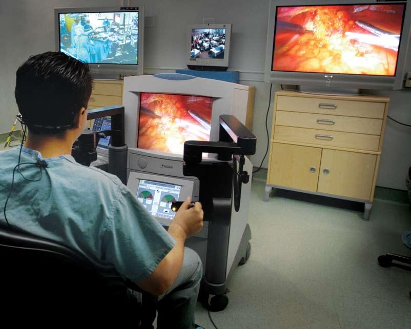 Seeing through an endoscopic camera and working via robotic arms, Dr.