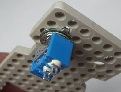 Insert the toggle switch into the 6 mm diameter hole drilled in the servo support plate,