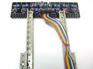 board. Bind the cable to one of the sensor arms.
