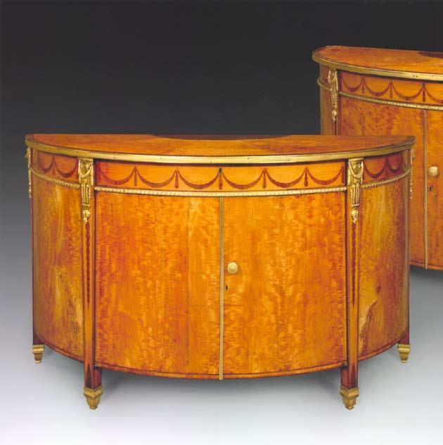 The Burlington House Commodes A Pair of George III Ormolu-mounted Satinwood and Marquetry Commodes, attributed to John Mayhew and William Ince, c.
