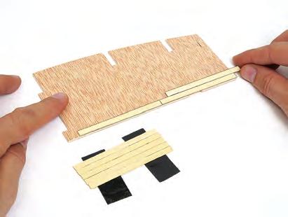 F G 1G Lay the wooden strips onto two pieces of adhesive tape so you have them