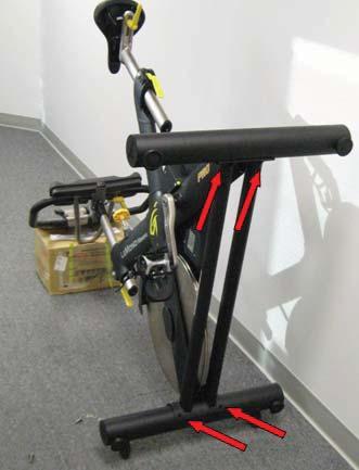 3. Tilt bike and install bottom bolts Tilt bike forward to access the bottom bolt holes.