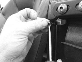 Step 6: Using a flat head screwdriver, remove c-clips retaining door hinge pins for upper &