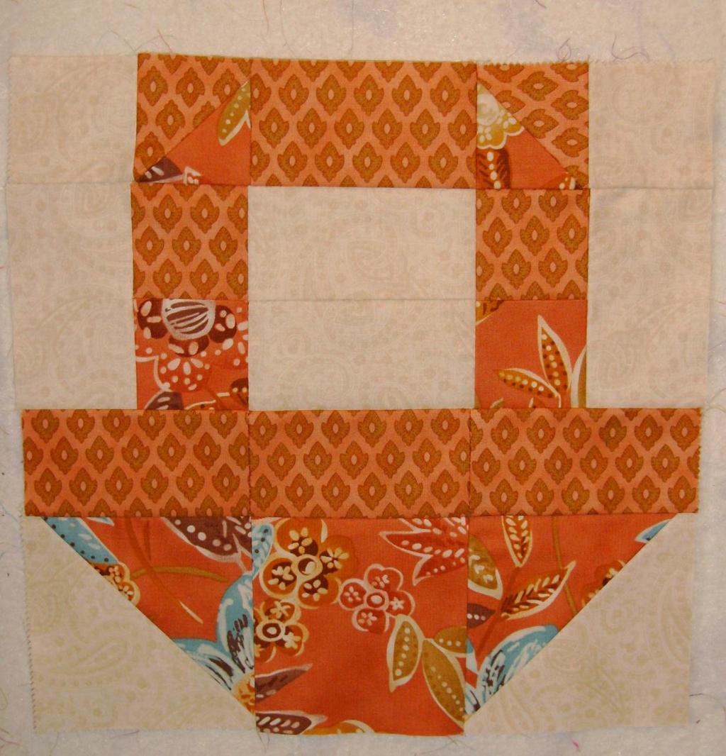 Join the two sections together to complete the block. Press seam towards basket.