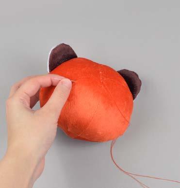 Once the plush is stuffed, make sure the seam allowances in the opening are tucked inside and prepare to ladder