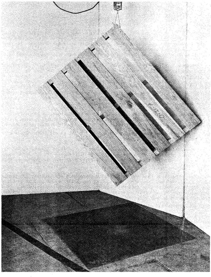 Figure 6.--Setup for free-fall-on-corner test of a 40- by 48-inch wood pallet.