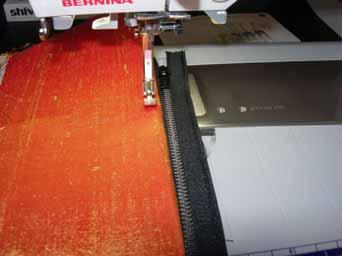 Then fold your fabric strip in half and stitch along the edge of the