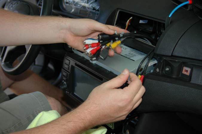 .. you will need to tuck the Dynavin wire harness back and to the left toward the instrument cluster.