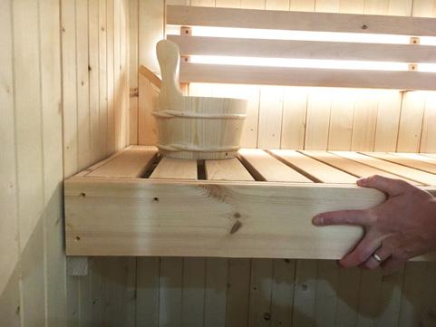 Using a damp cloth with warm water, wipe down the entire sauna including the benches to remove any remaining dirt, dust and debris. Step 11.