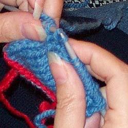 Wrap the next stitch [so that it now has two wraps] and turn.