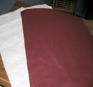 For the back, cut a piece of batting and a piece of the solid colored quilter's cotton to 20 x 25 1/2 inches. Assemble the Wall Hanging Lay the front panel right side up.