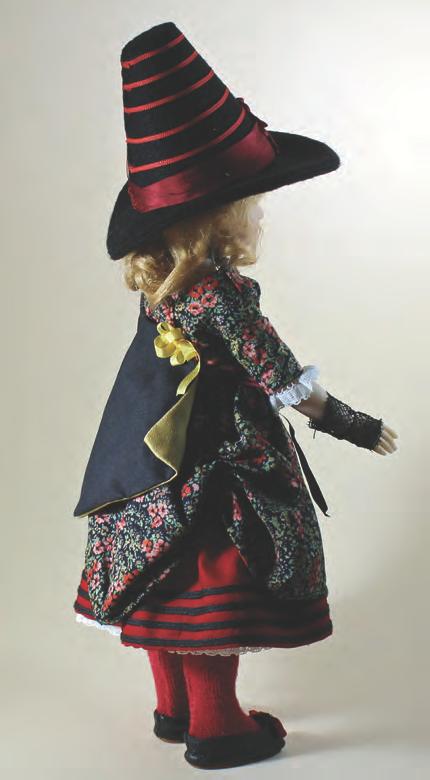The overdress, cape and hat all utilize a method of construction referred to as dolly flatlining.
