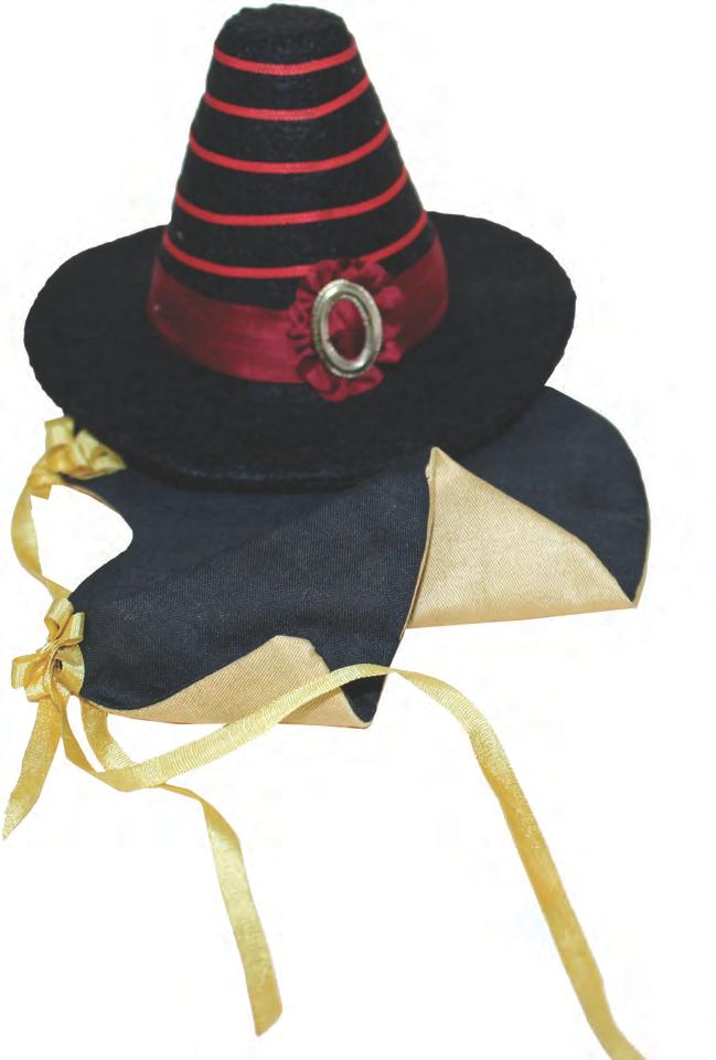 It is made of a good grade of felt, trimmed with narrow and wide ribbon and a large doll shoe buckle. Glue is always useful when making headgear.