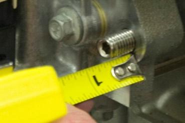 Install a 5/16 split washer on each of the two 5/16-18 x 2-3/4 socket head cap screws followed by anti-seize to