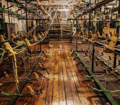 Once the warp is created it is moved to one of two types of looms each of which must be hand programmed using state-of-the-art (from the depression era) technology (punch cards or roller chains).