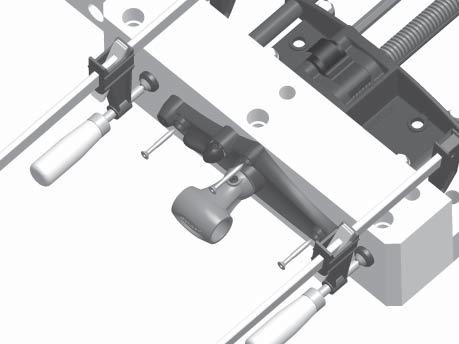) Rotate cam lever to "up" position to release main screw. Figure 11: Mounting screw hole depth. Install the #14 flat-head screws to secure the front plate to the front jaw.
