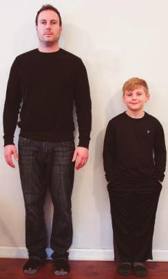 Here is a picture of the same man standing next to a child.