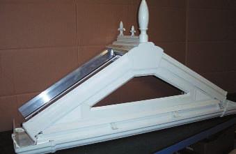 Place ridge assembly in position and fit gable rafters, first to ridge then to eaves via gable