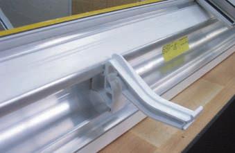 The bottom clip on the gutter bracket should then be clipped to the continuous aluminium leg on the eaves beam.