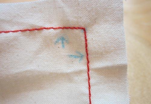 When approaching your corner, shorten your stitch length for a distance equal to your seam allowance. Do this both coming into and going out of the corner.