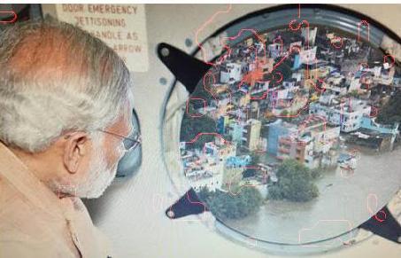 [7] It is presented as Modi looking through the round window of a helicopter, through which a clear view of waterlogged buildings were visible.