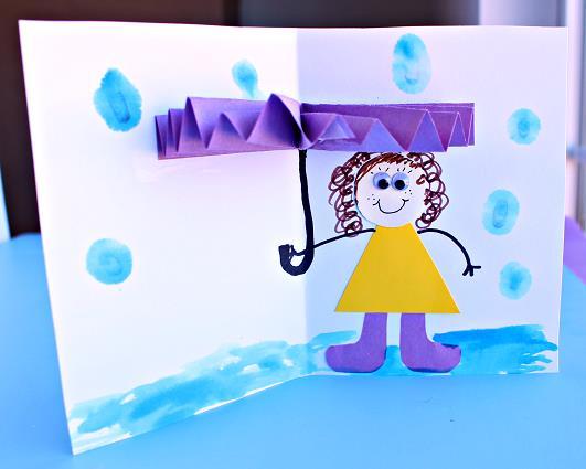 Wee Mentor (6+ years): 3D Rainy Day Card Purple, yellow, tan paper Scissors Glue/tape Google eyes Markers Watercolours What to do: 1. Start by cutting a rectangle out of coloured paper.
